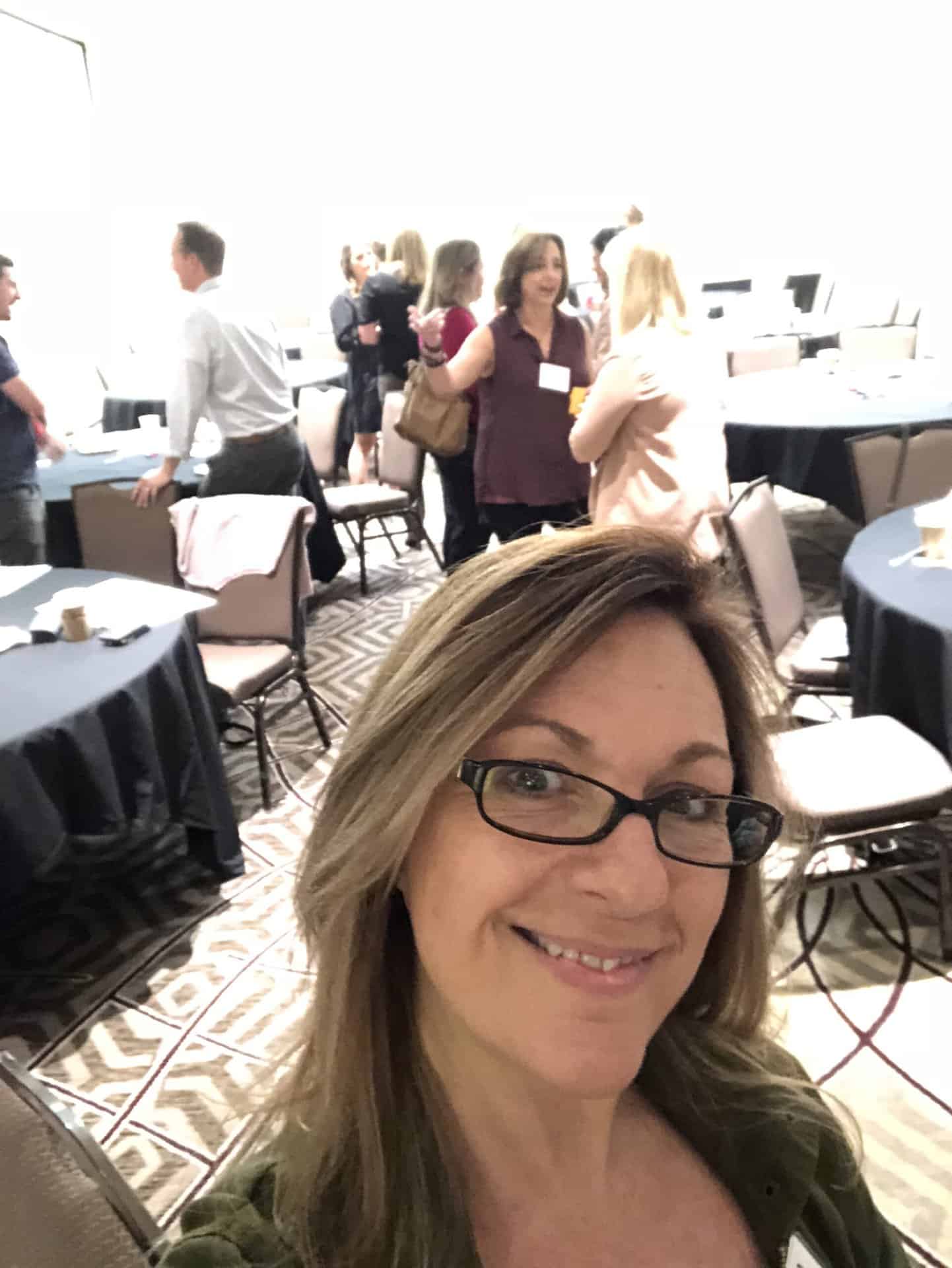 A selfie of Shannon Tipton at a conference.